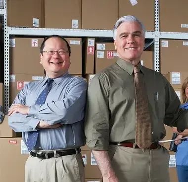Equipment vendor partners in their warehouse
